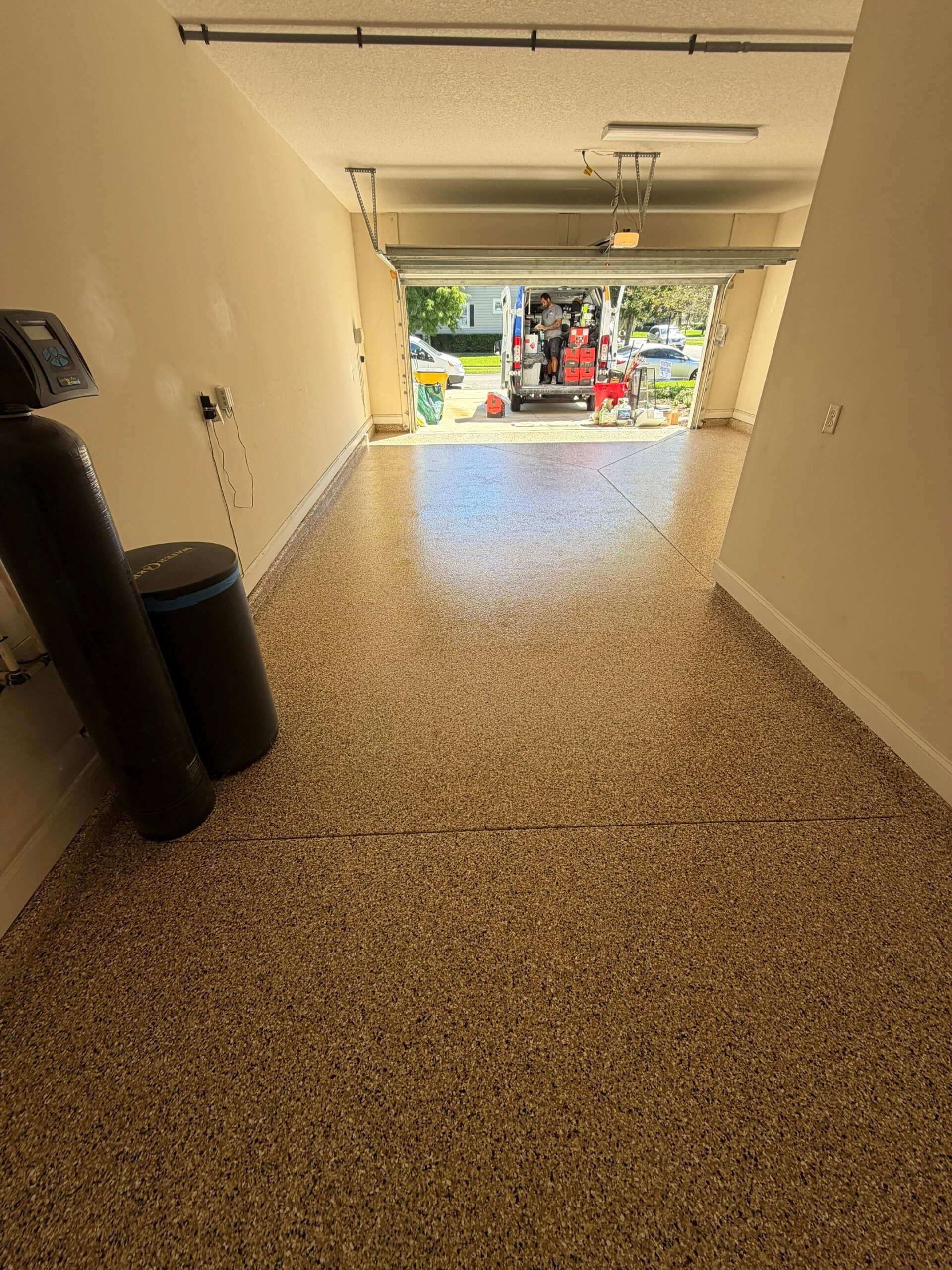 Finished garage floor with decorative flake polyurea coating in Nocatee, FL