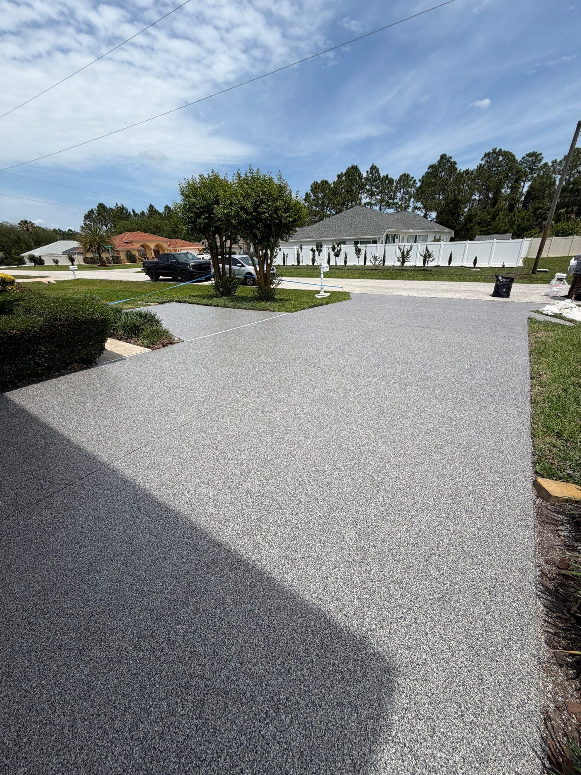Wide view of resurfaced driveway and approach